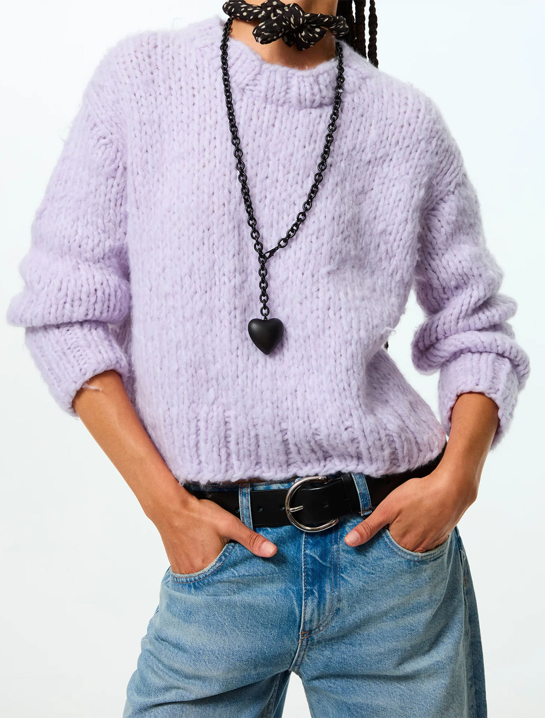 model wearing the puffy heart necklace in black