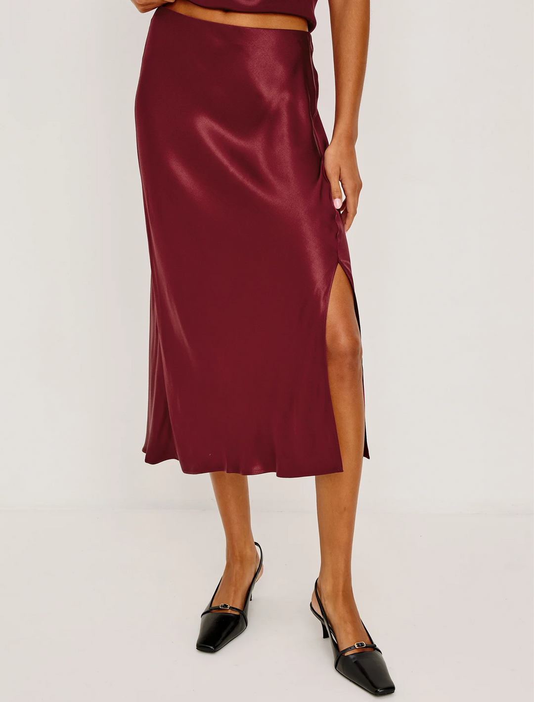 model wearing maya skirt in garnet