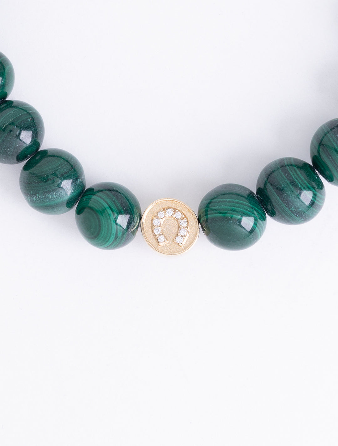 diamond and gold luck and protection bead on malachite beaded bracelet