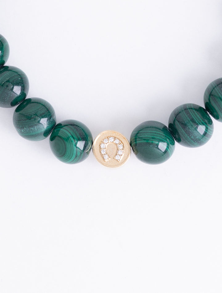 diamond and gold luck and protection bead on malachite beaded bracelet