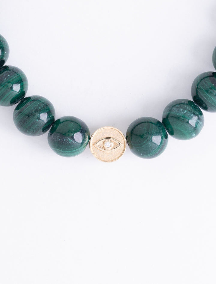diamond and gold luck and protection bead on malachite beaded bracelet