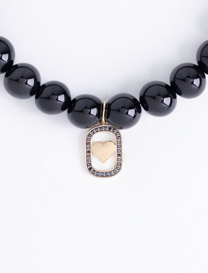 heart open icon charm on 8mm onyx beaded bracelet
