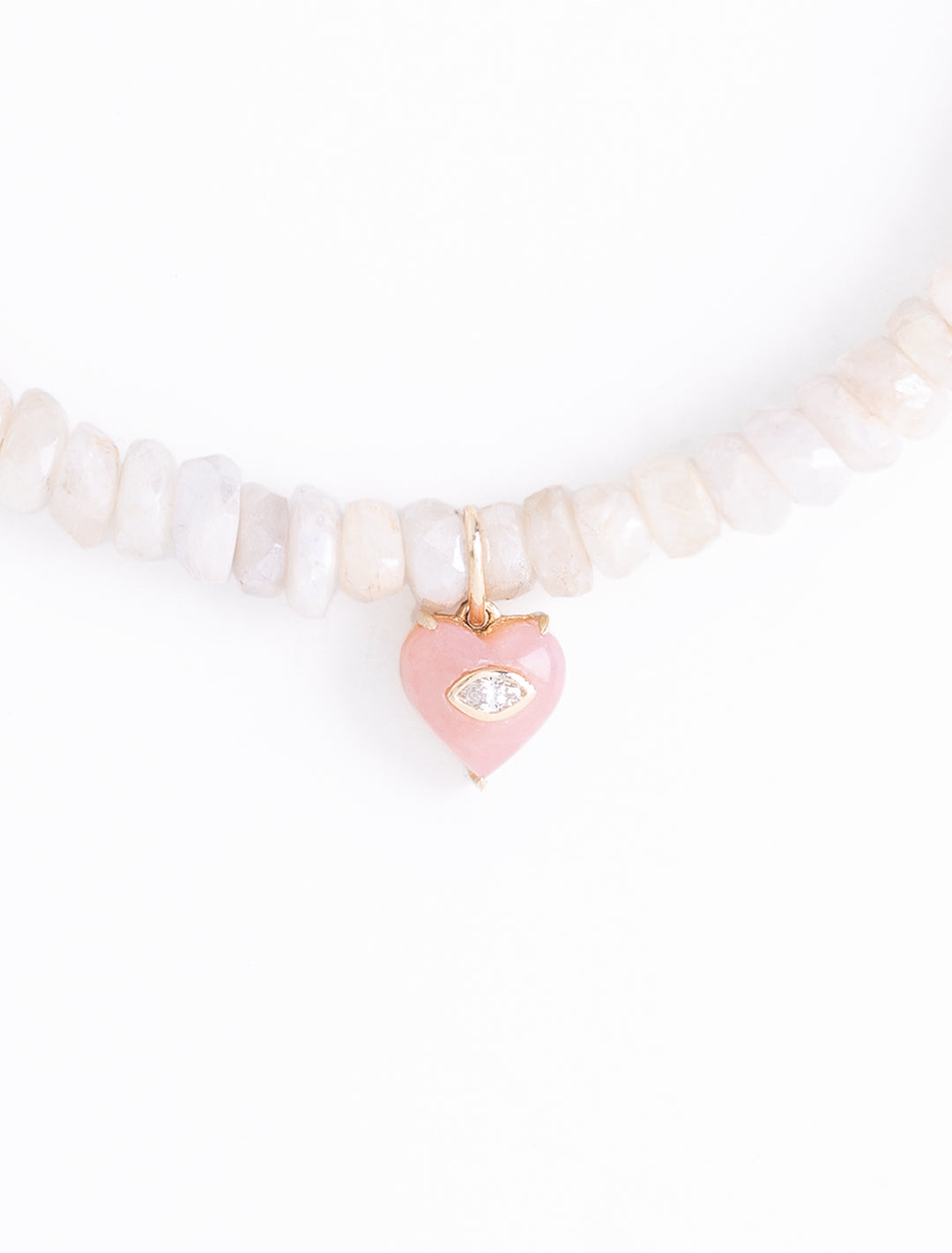 small carved stone marquise bezel heart charm on ethiopian opal beaded bracelet