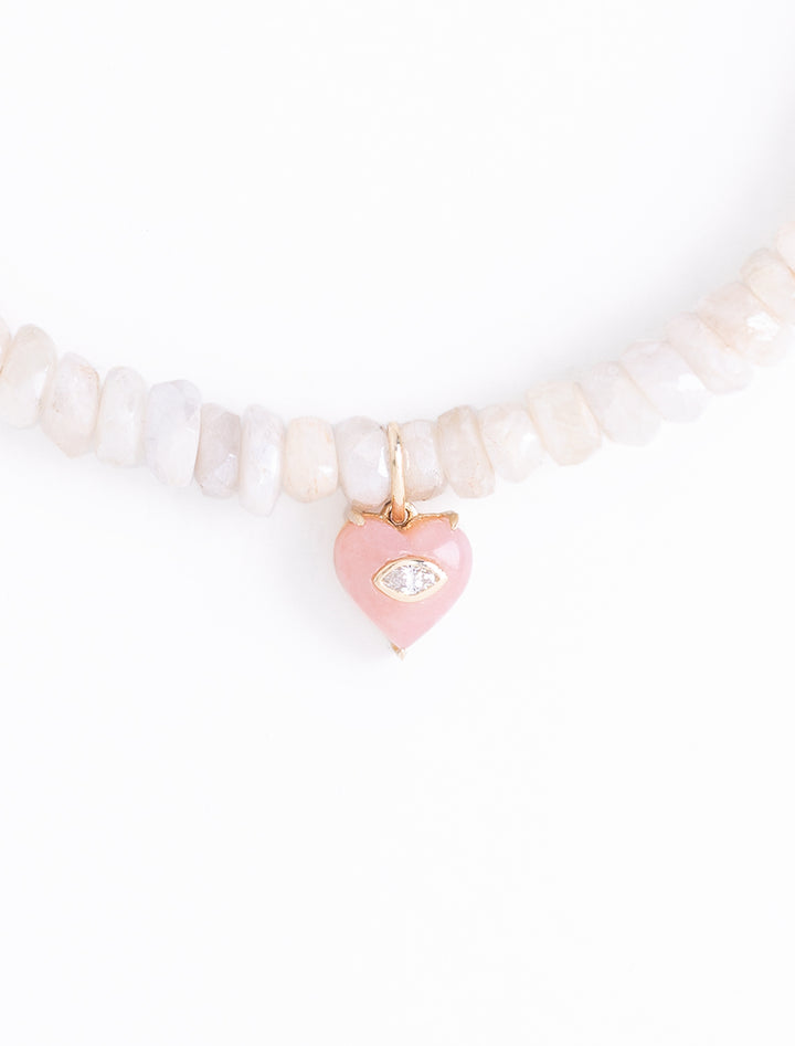 small carved stone marquise bezel heart charm on ethiopian opal beaded bracelet