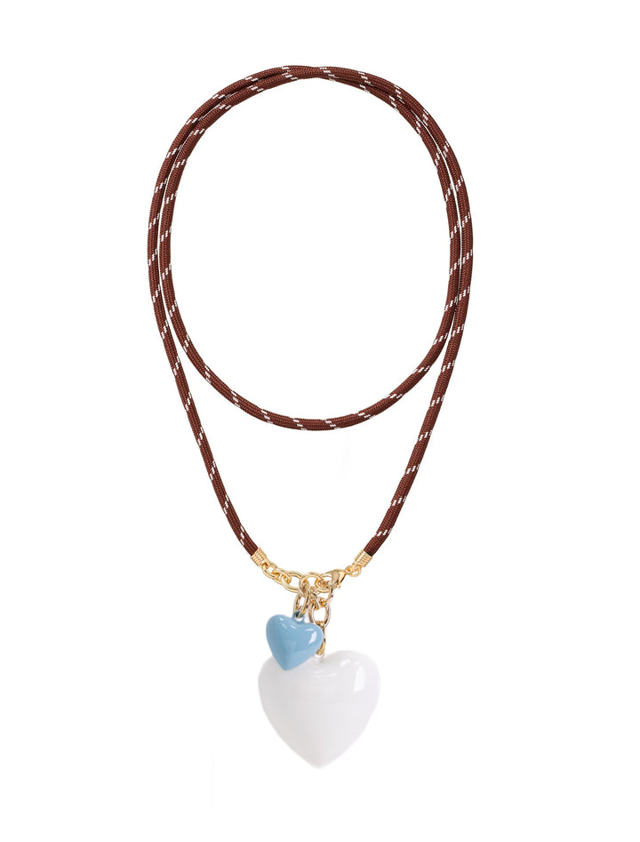 brown long cord necklace with large cream and small cloud hearts