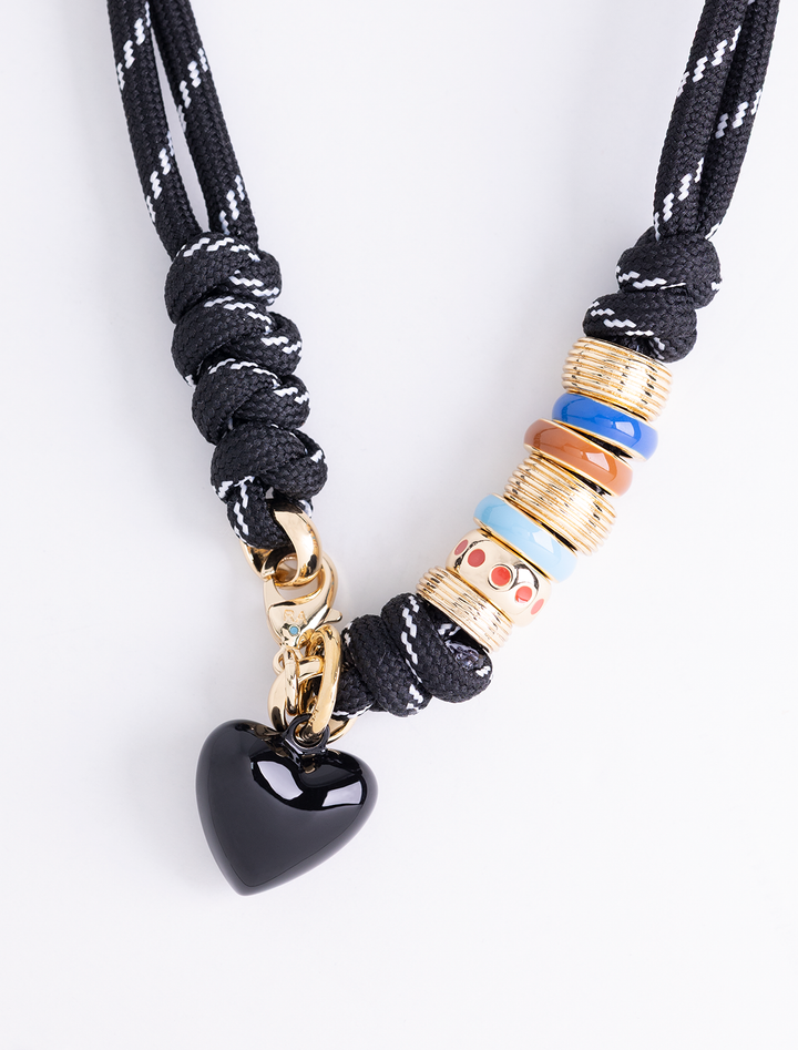 super size happy cord necklace in black with black hearts