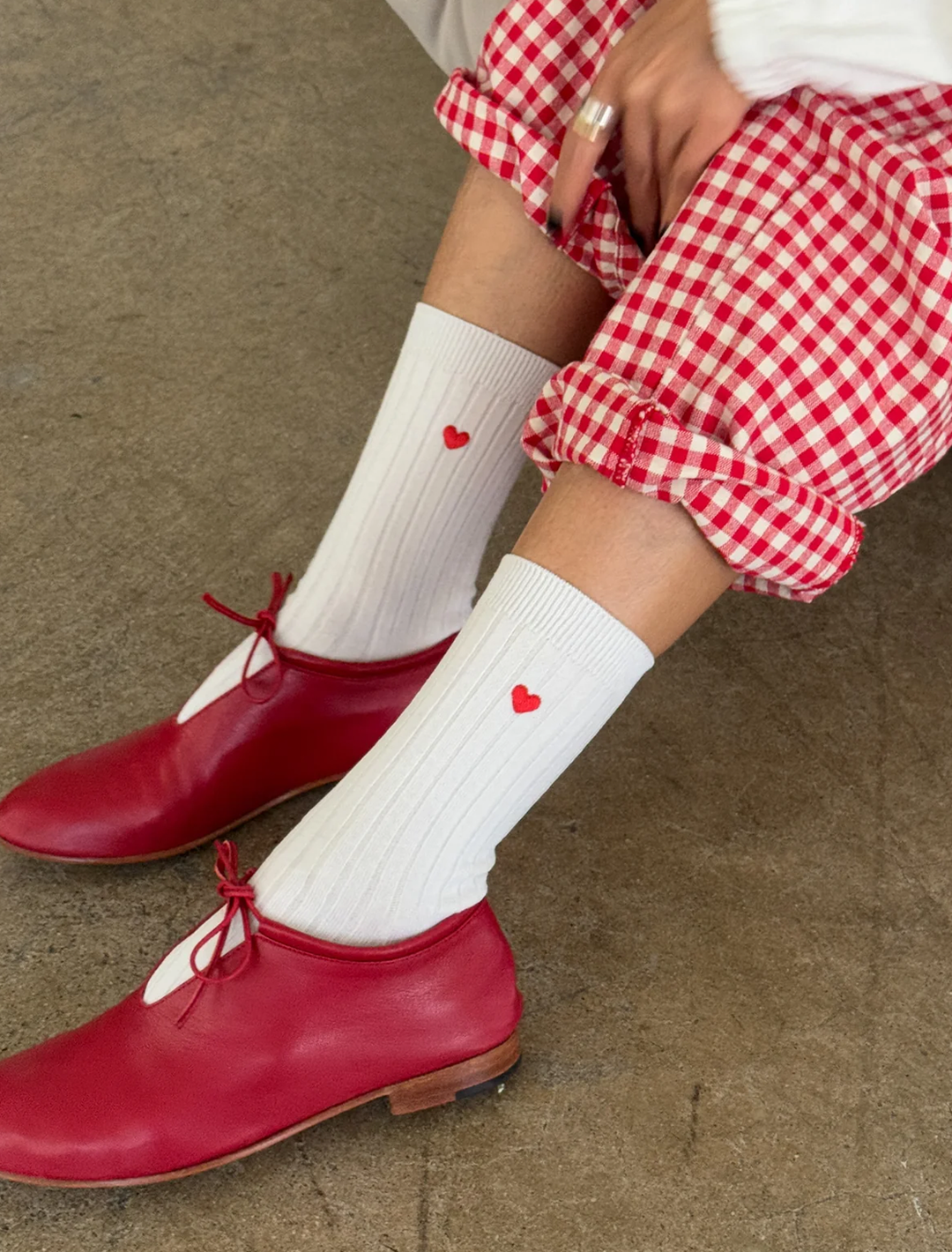 her socks in white with embroidered heart