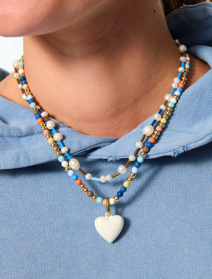 the happy baby bead necklace duo in creme