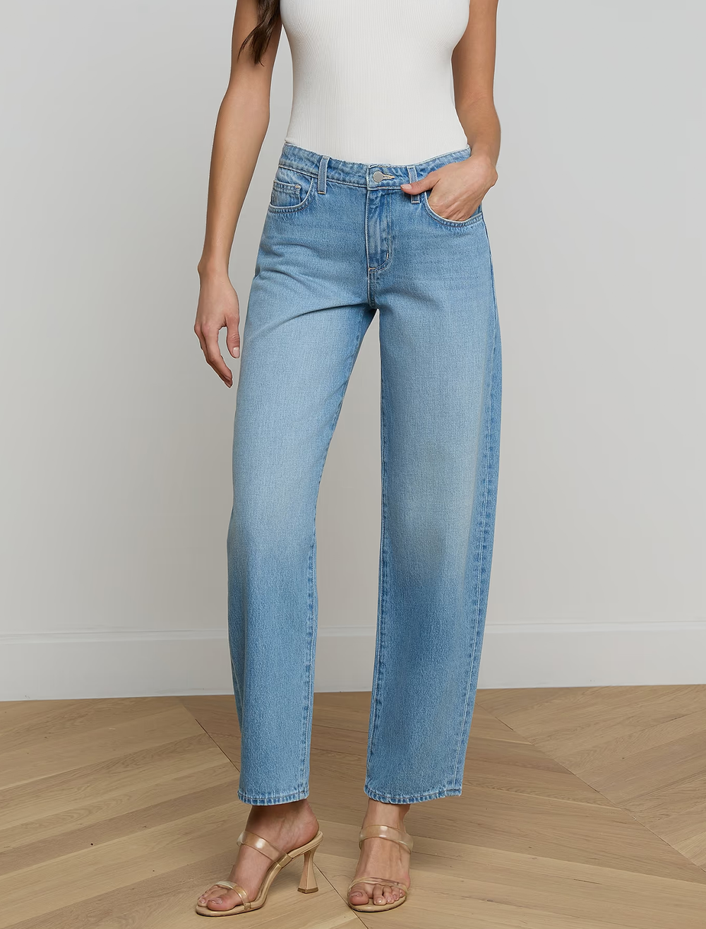 Model wearing L'Agence's bex rodeo jeans in bellflower.