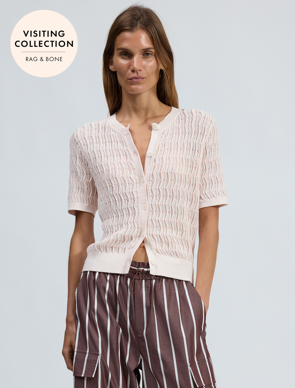 model wearing leslie short sleeve cardigan in light pink