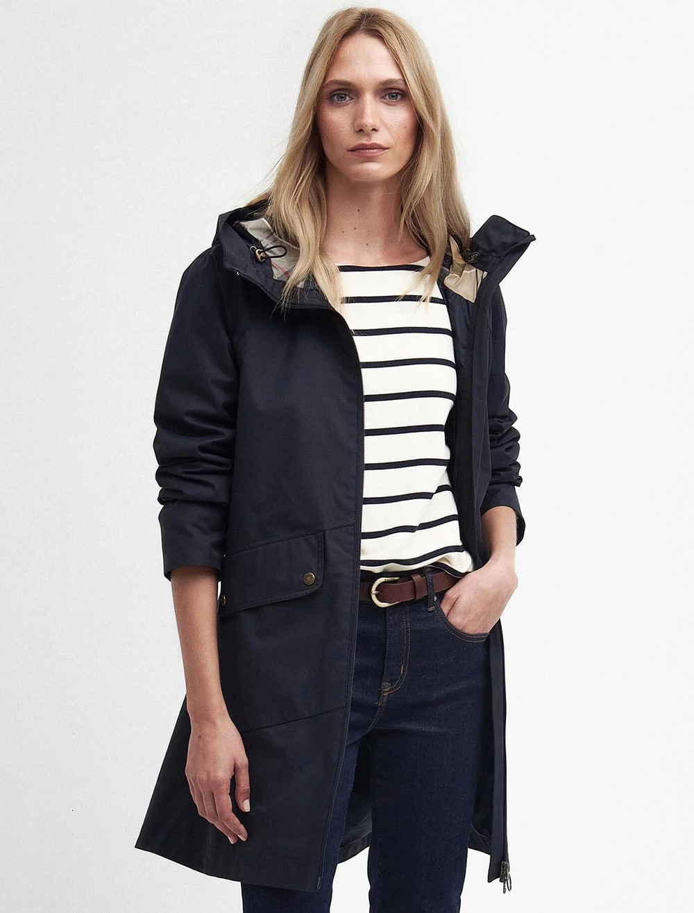 Model wearing Barbour's heron waterproof jacket in navy