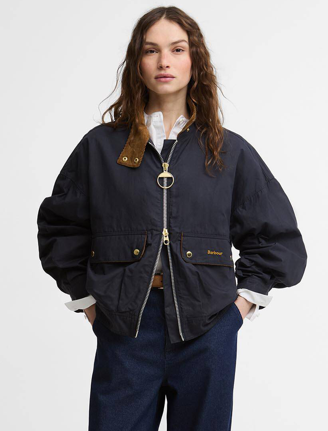 Model wearing Barbour's blackthorn casual jacket in navy.