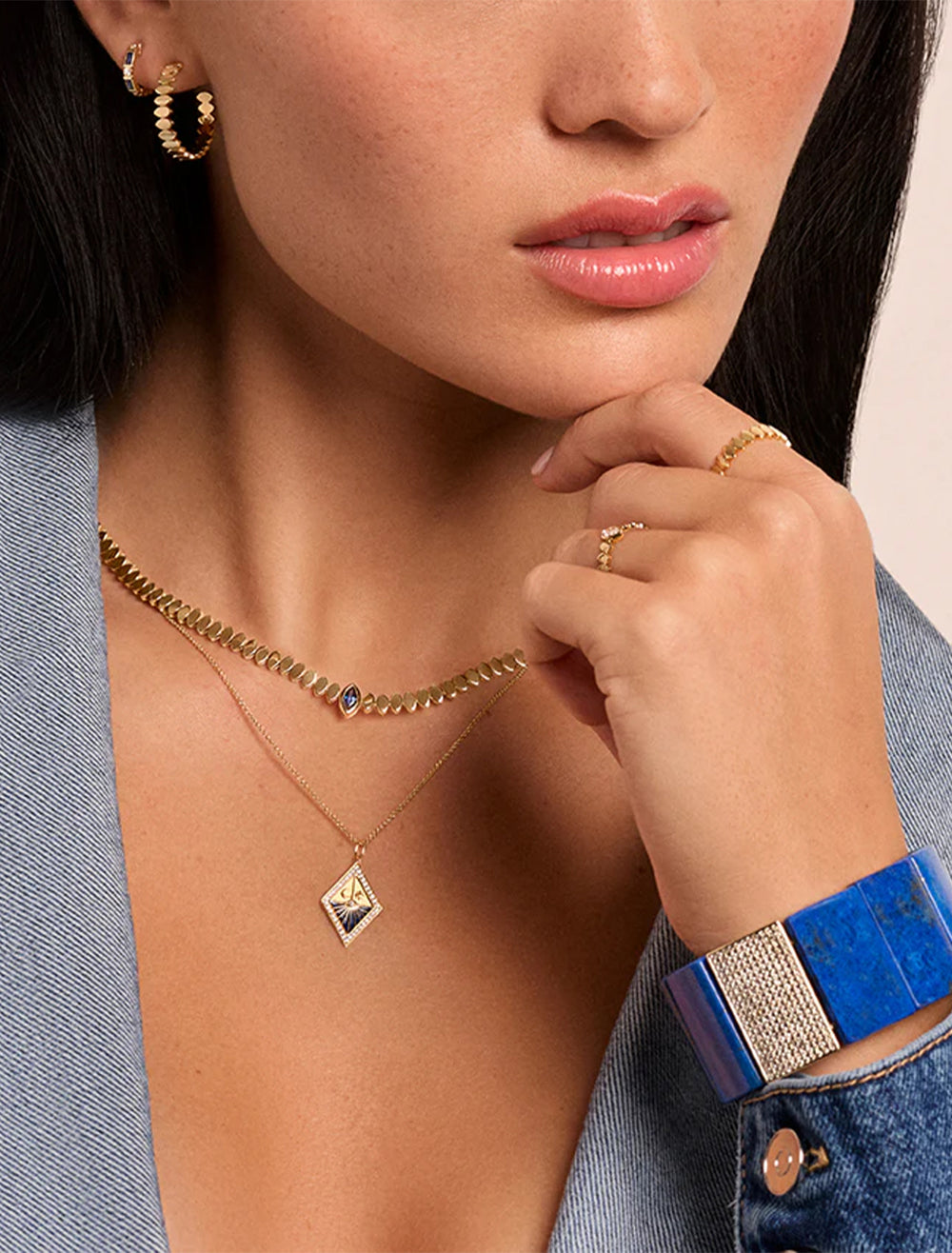 Model wearing Sydney Evan's pure marquise medium hoops.