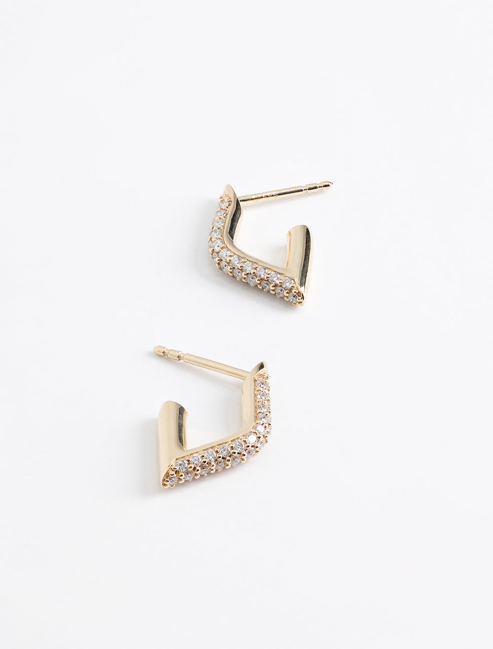 Overhead view of Sydney Evan's pave hollow tube marquis eye earring small.