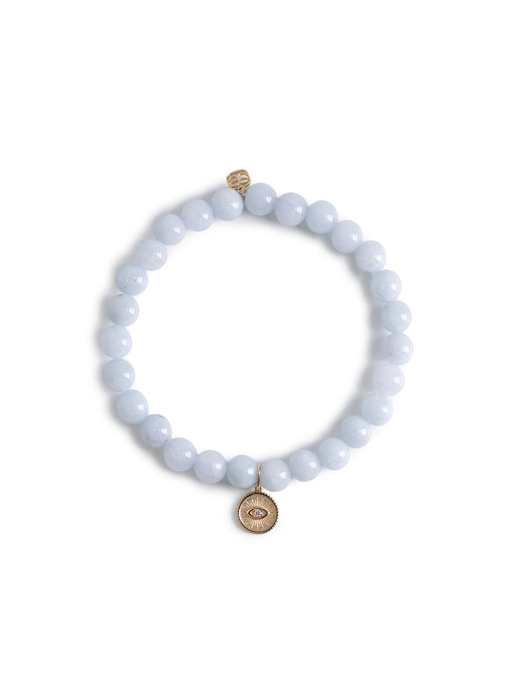 small marquise eye coin charm on aquamarine