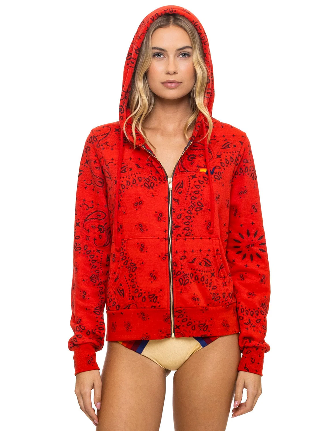 Model wearing Aviator Nation's bandana zip hoodie in flash red.
