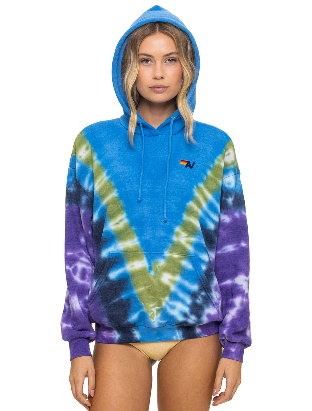 Model wearing Aviator Nation's hand dyed v relaxed hoodie in tie dye ocean and purple.