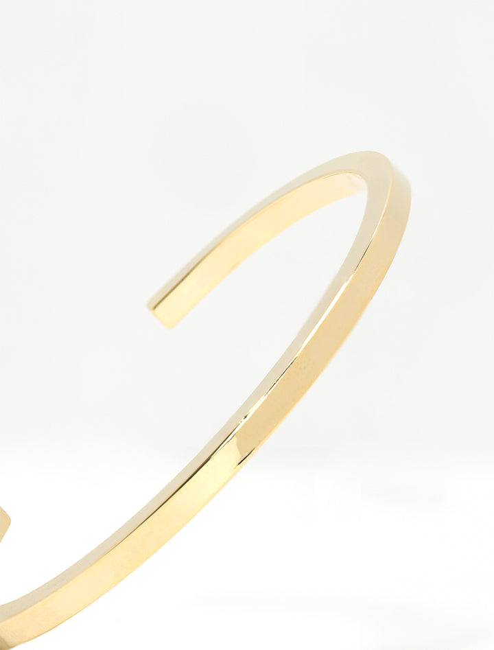 Close-up view of AV Max gold squared edge cuff