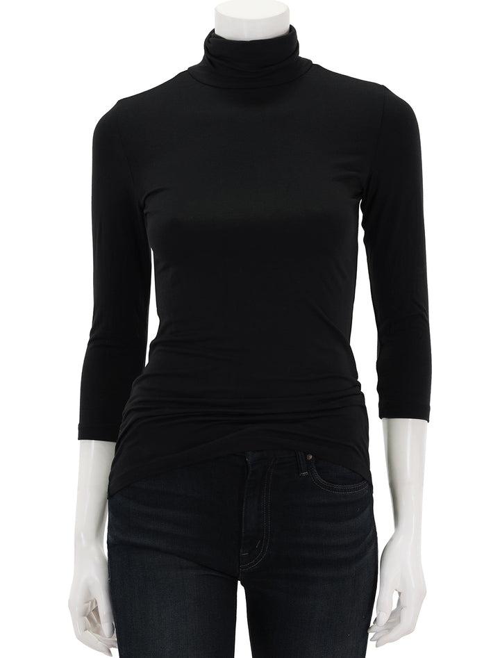 Front view of L'agence's aja modal turtleneck in black.