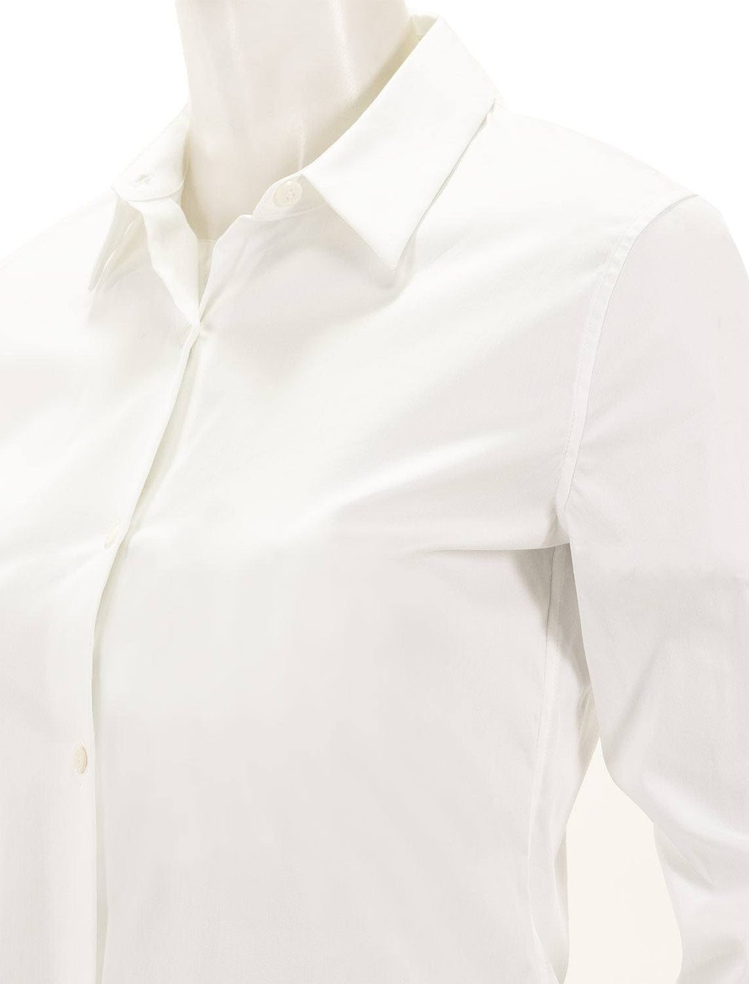 Close-up view of Theory's tenia luxe button up shirt in white.