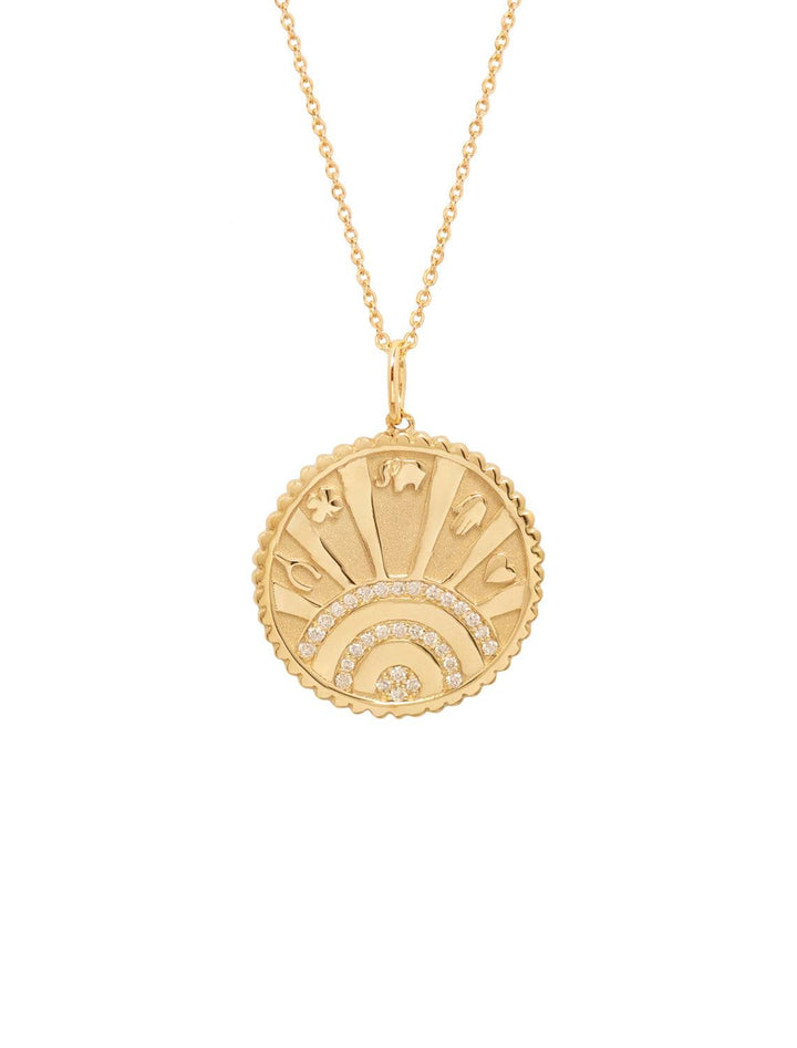 small pave luck coin necklace, which features a pave set sun with rays and small charm engravings of four leaf clover, elephant, hamsa hand, wishbone and heart