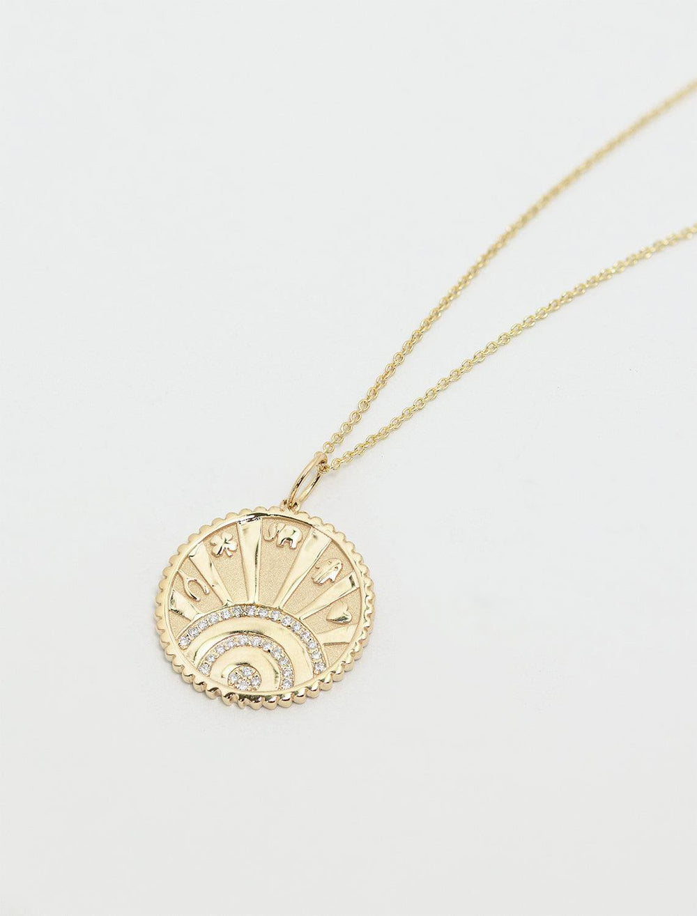 showing detailed shot of small pave luck coin necklace on fine 14k chain