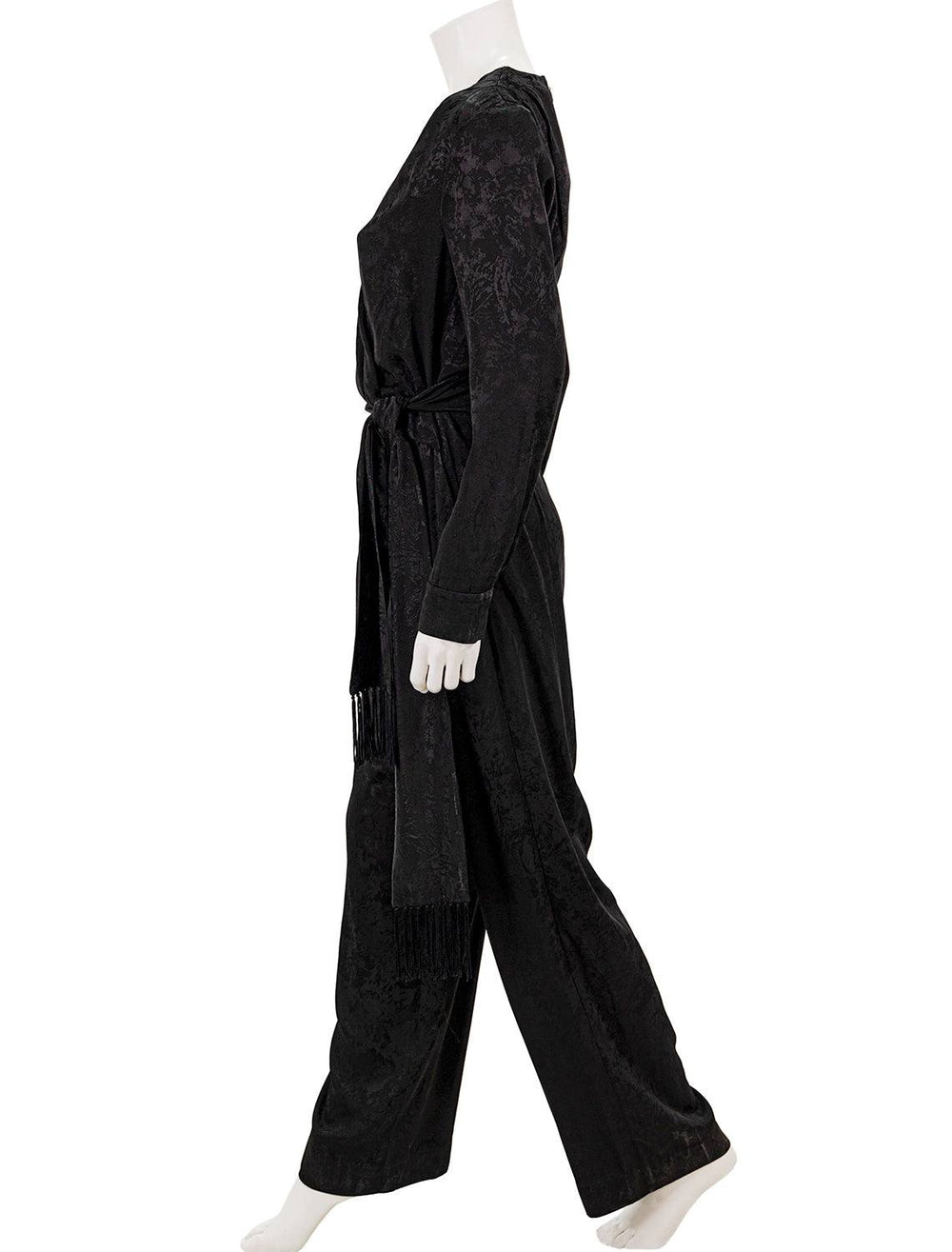 Side view of Jonathan Simkhai's julia jacquard wrapped jumpsuit in black.