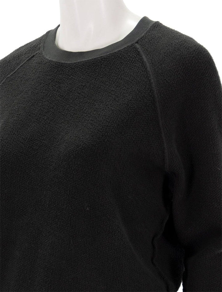 Close-up view of Perfectwhitetee's ziggy inside out sweatshirt in vintage black.