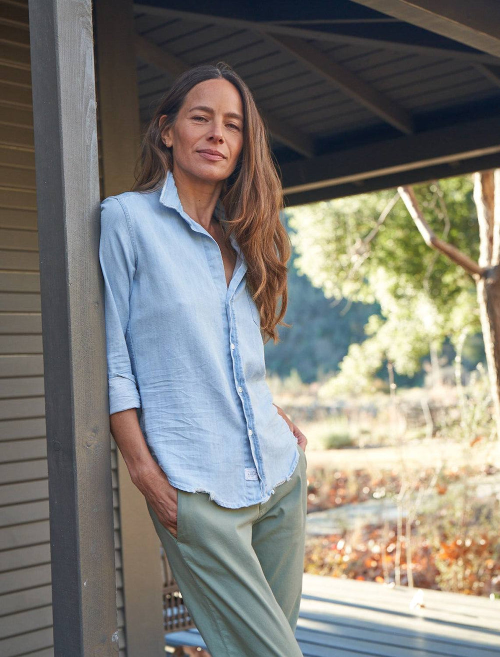 model wearing barry in classic blue tattered wash with olive colored pants