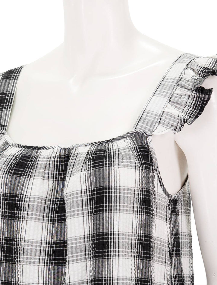 close up view of prairie life dress plaid pattern, square neckline, and cap sleeves