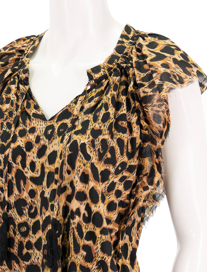 close up view of copley dress in cheetah flowy cap sleeve and unfinished hem