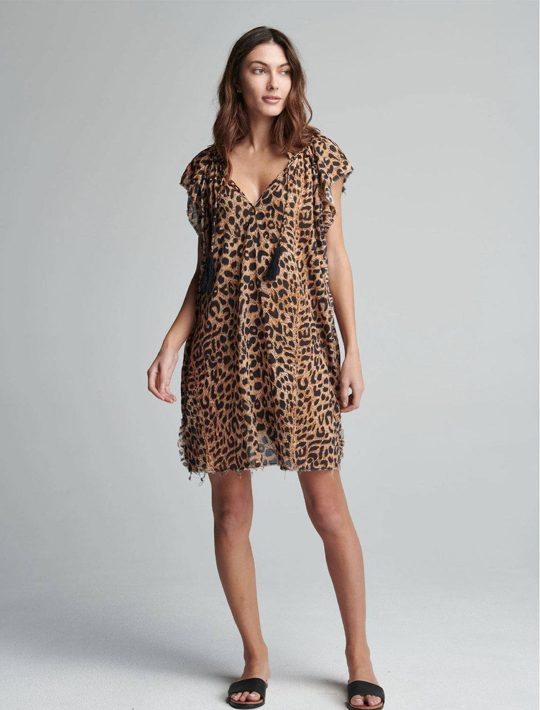 model wearing copley dress in cheetah with black sandals