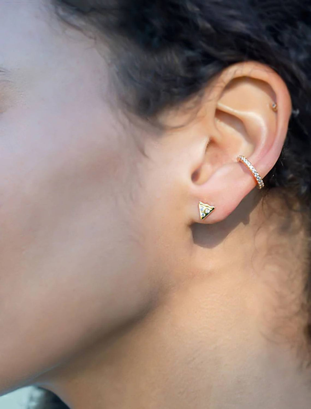 model wearing pizza studs
