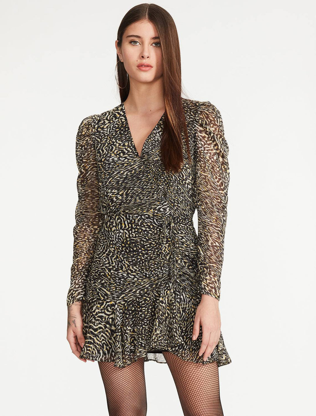 model wearing nyla dress in black multi print with fishnets