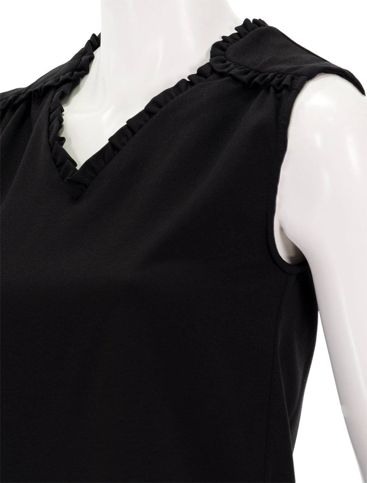 close up view of camisa ross top in black ruffle details