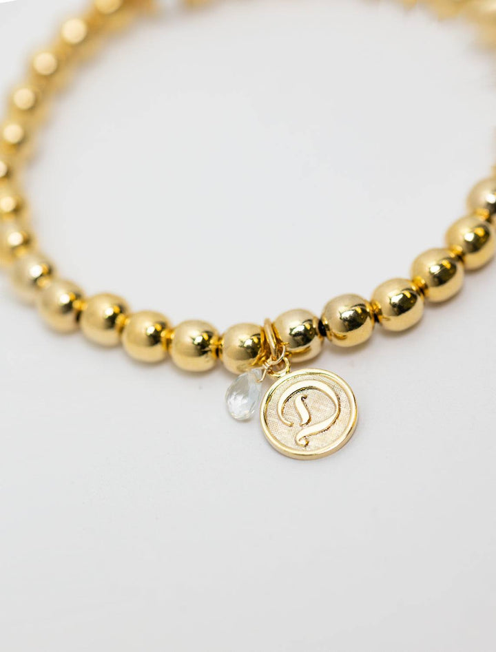 close up view of beaded monogram bracelet | D charm and gem