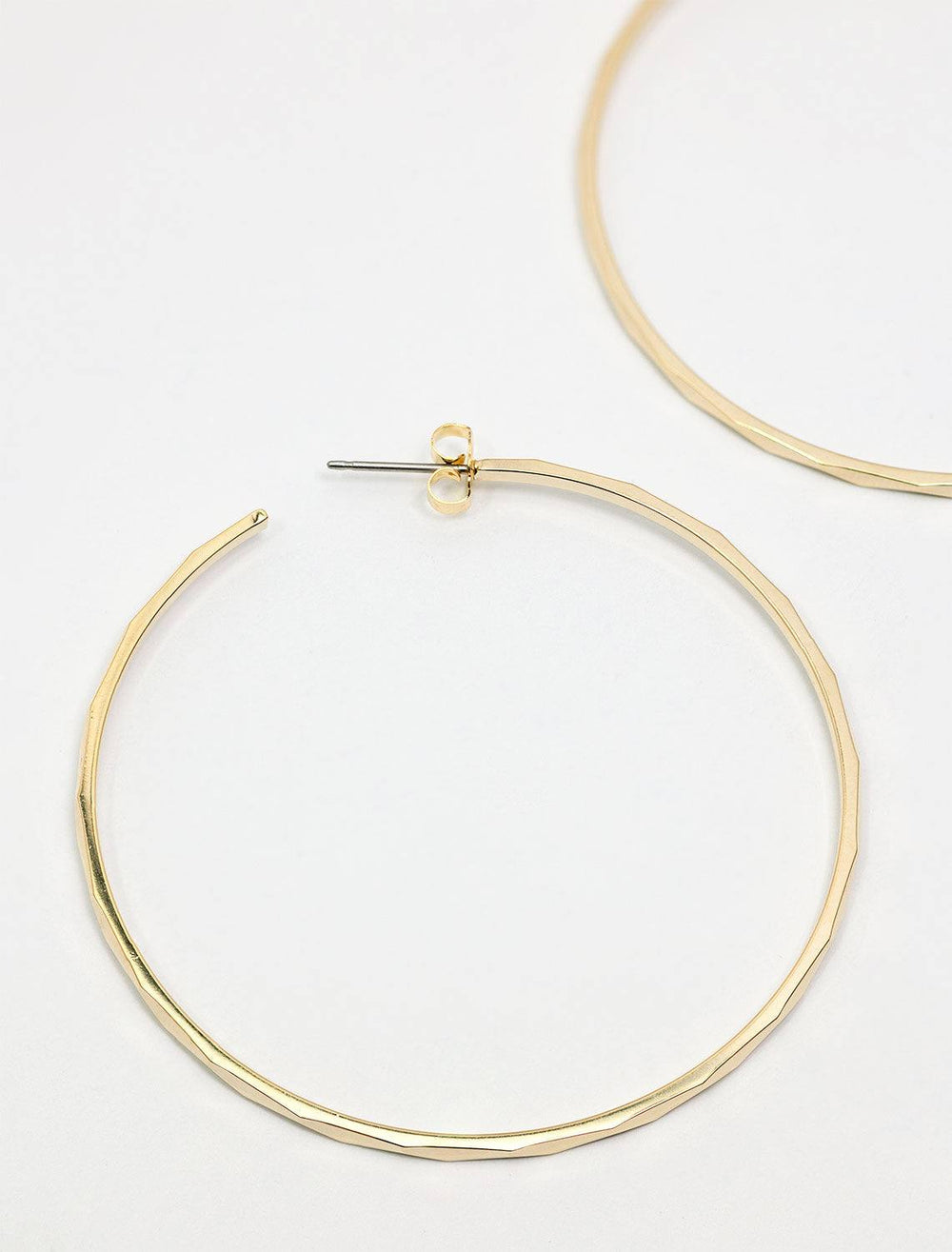 close up styled view of nolita hoops in gold