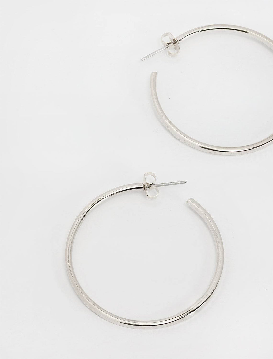 top down styled view of disco ball hoops in silver