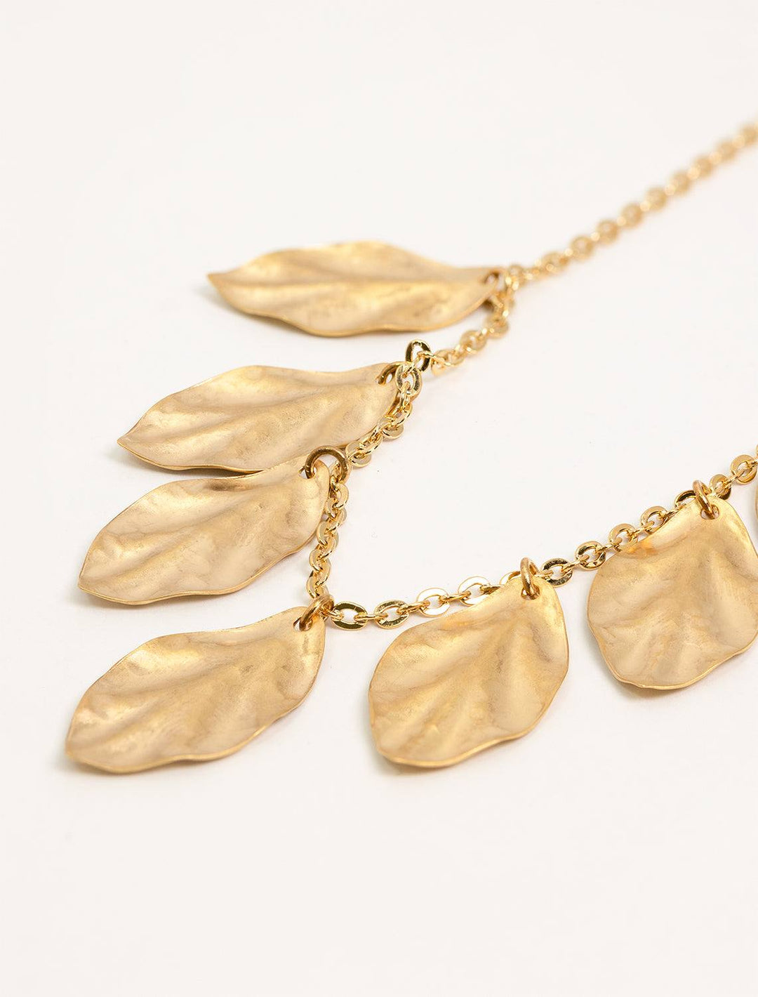 close up of athena necklace leaf details