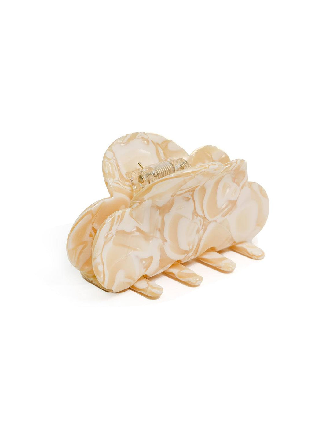 angled view of the cloud hair claw in cream and tan tones
