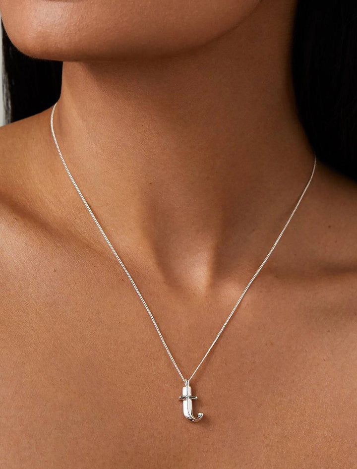 model wearing monogram necklace in silver | T