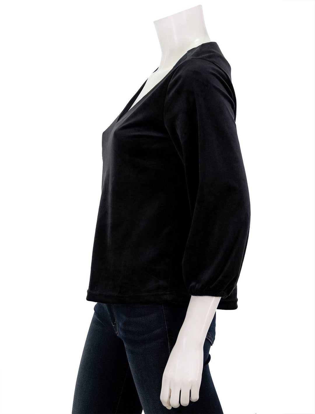 Side view of Marine Layer's velour v neck top in black.