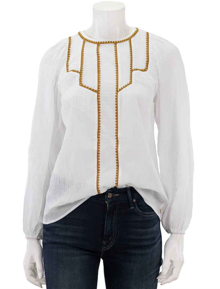 Front view of Scotch & Soda's white patchwork bib blouse with embroidery.