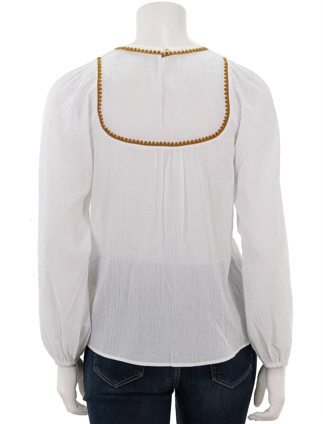 Back view of Scotch & Soda's white patchwork bib blouse with embroidery.