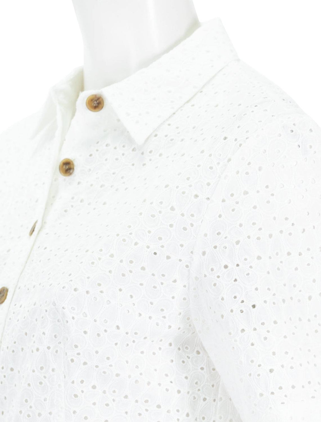 close up shoulder view of lea eyelet short sleeve blouse in full moon