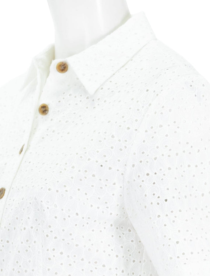close up shoulder view of lea eyelet short sleeve blouse in full moon