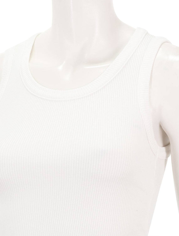 close up shoulder view of poppy tank in white