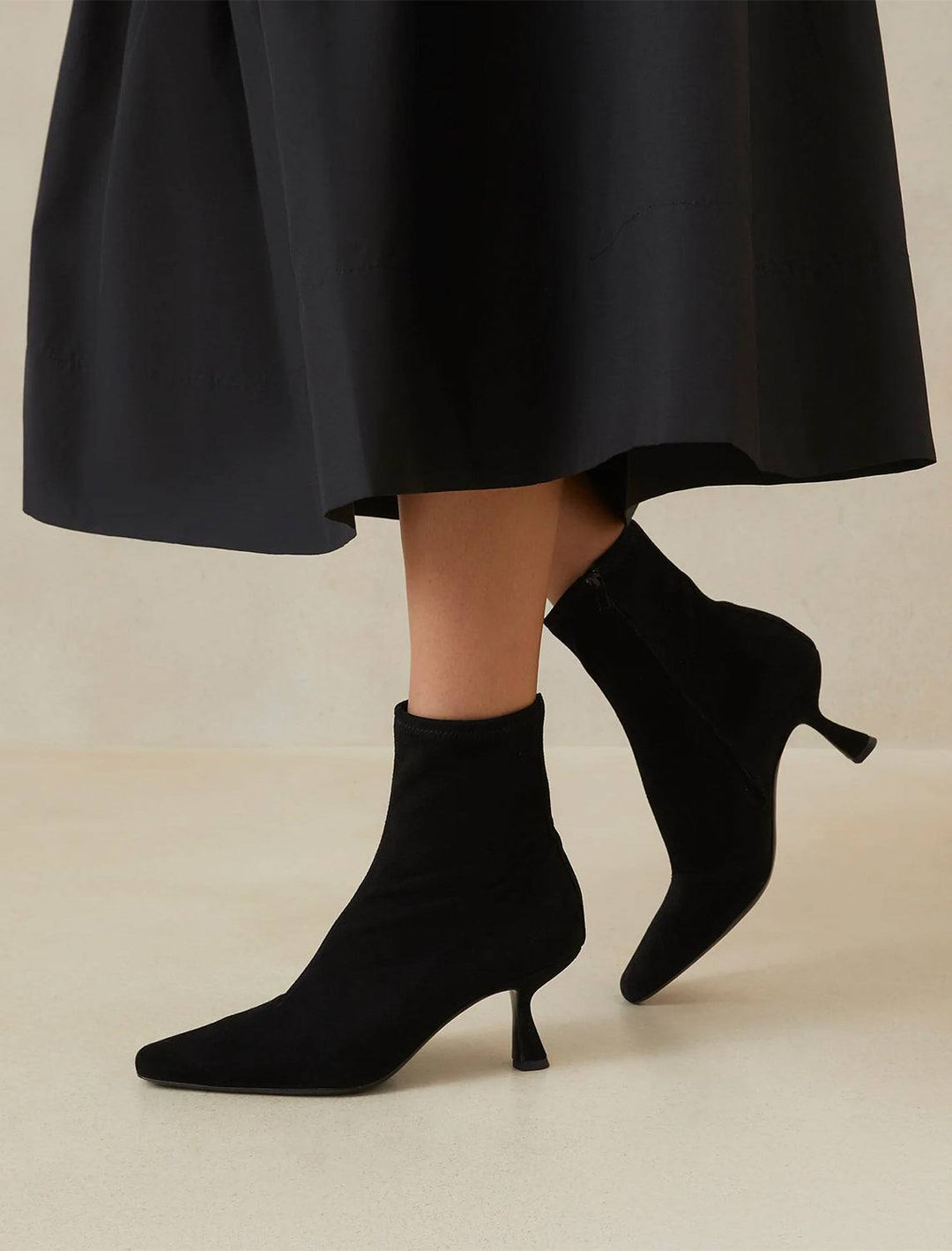 Model wearing Loeffler Randall's thandy boot in black.