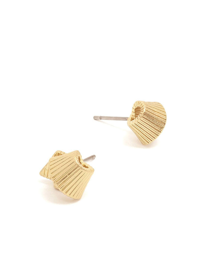 Stylized laydown of Clare V.'s ribbon studs in vintage gold.