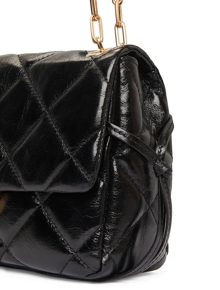 Close-up view of Vanessa Bruno's moon mm handbag in noir.